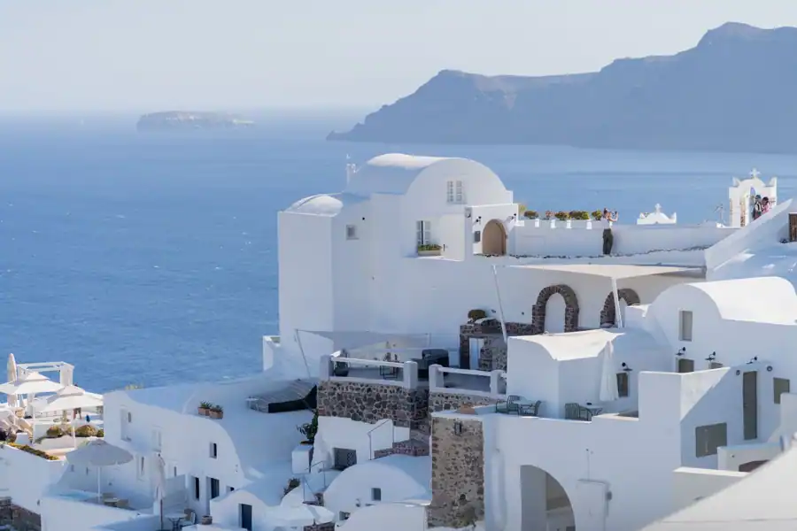 Beautiful whitewashed buildings overlooking the Aegean Sea in Santorini, Greece.