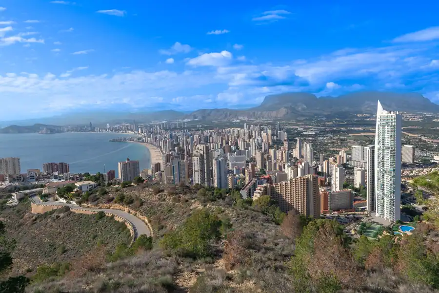 Stunning aerial view of Benidorm skyline along the Mediterranean coast with clear skies.